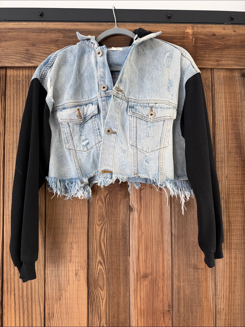 Vici Light Blue Cropped Denim Jacket with Black Hoodie Sleeves